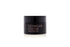 A black skincare jar labeled &