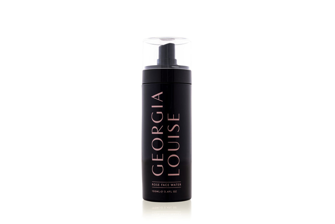A black bottle with a pump dispenser labeled &