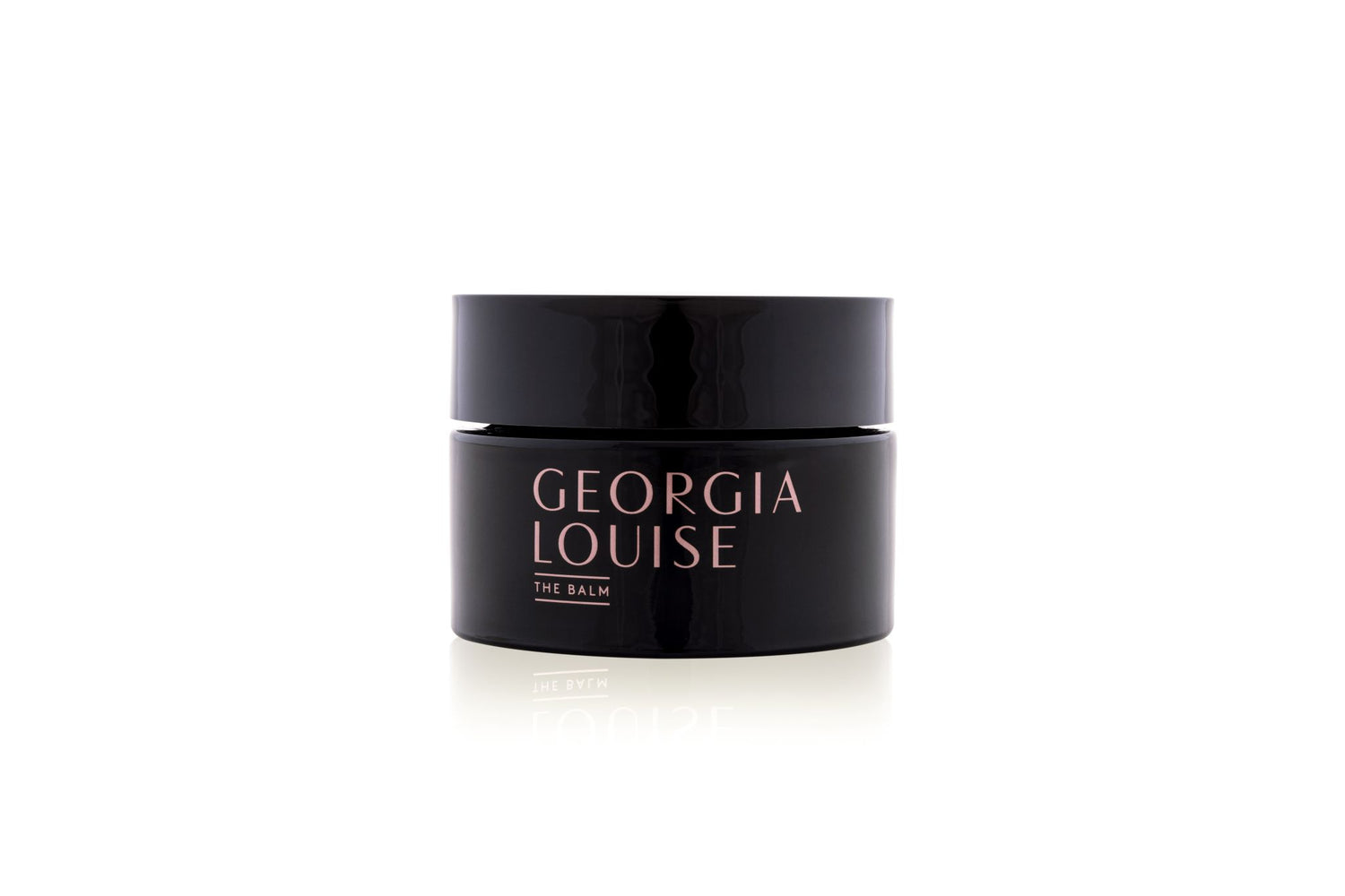 Black jar of Georgia Louise eye balm on a white background.