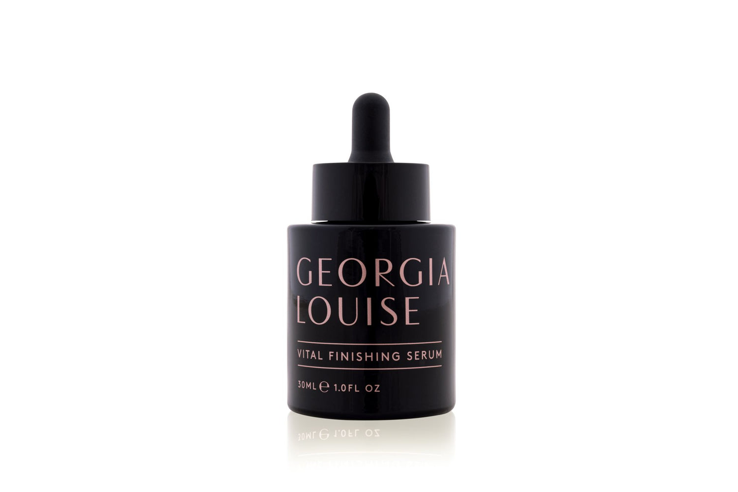 A bottle of Georgia Louise Total Finishing Serum with a dropper top on a white background.