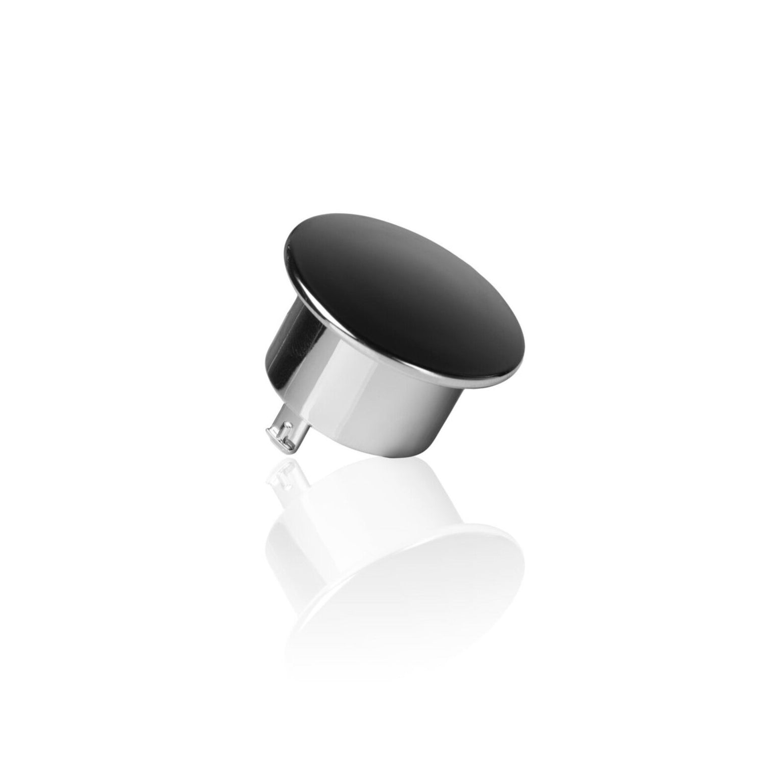 A sleek black and silver bottle cap with a reflective surface