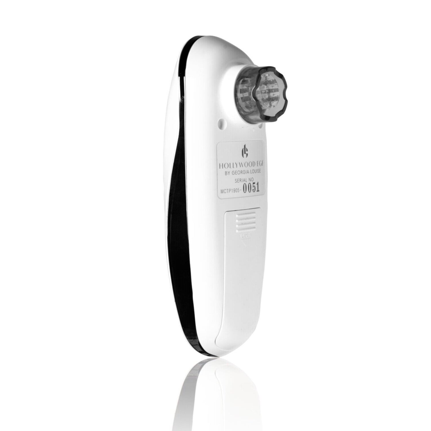 A sleek white handheld device with a circular dial, used for skin treatment or cosmetic procedures.