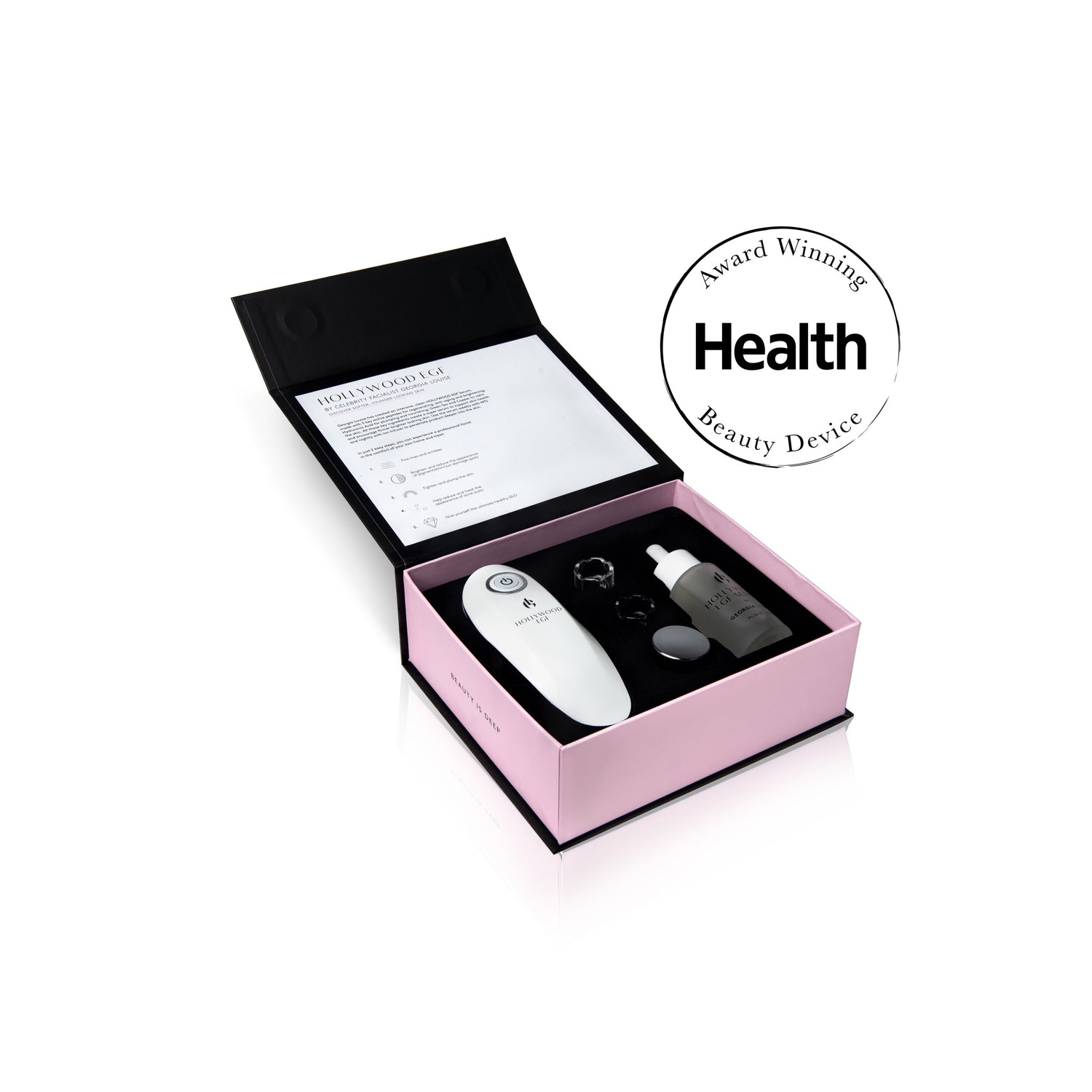 Beauty device kit in a pink box with instructions and health award emblem.