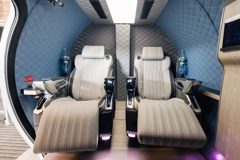 Luxury interior of a Hyperbaric Chamber with beige seats and blue walls.